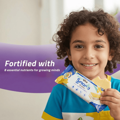 Child holding aSmarty Vanilla Milk Wafer Fortified with Vitamins and Minerals for growing minds